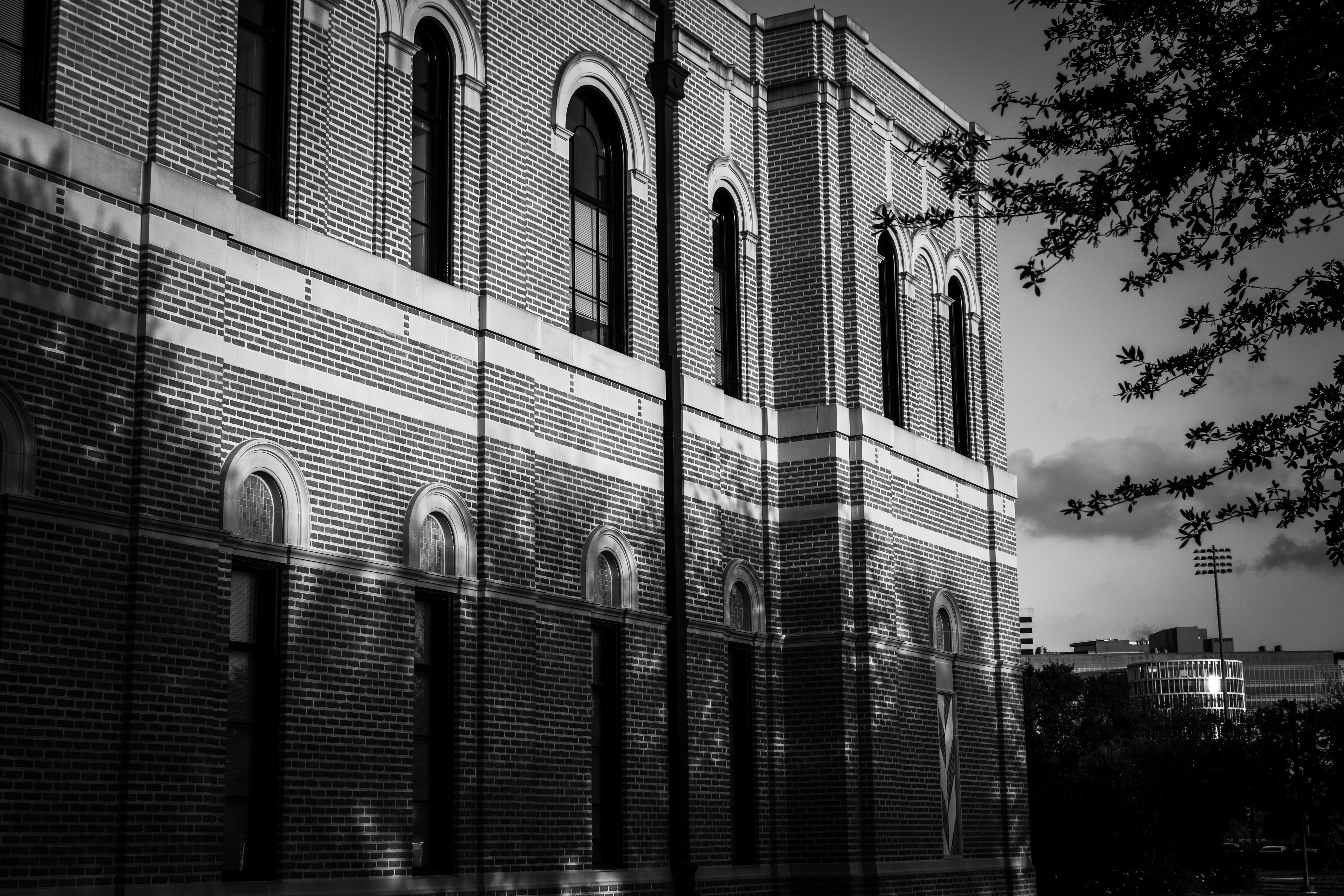 Modern building facade against storm clouds