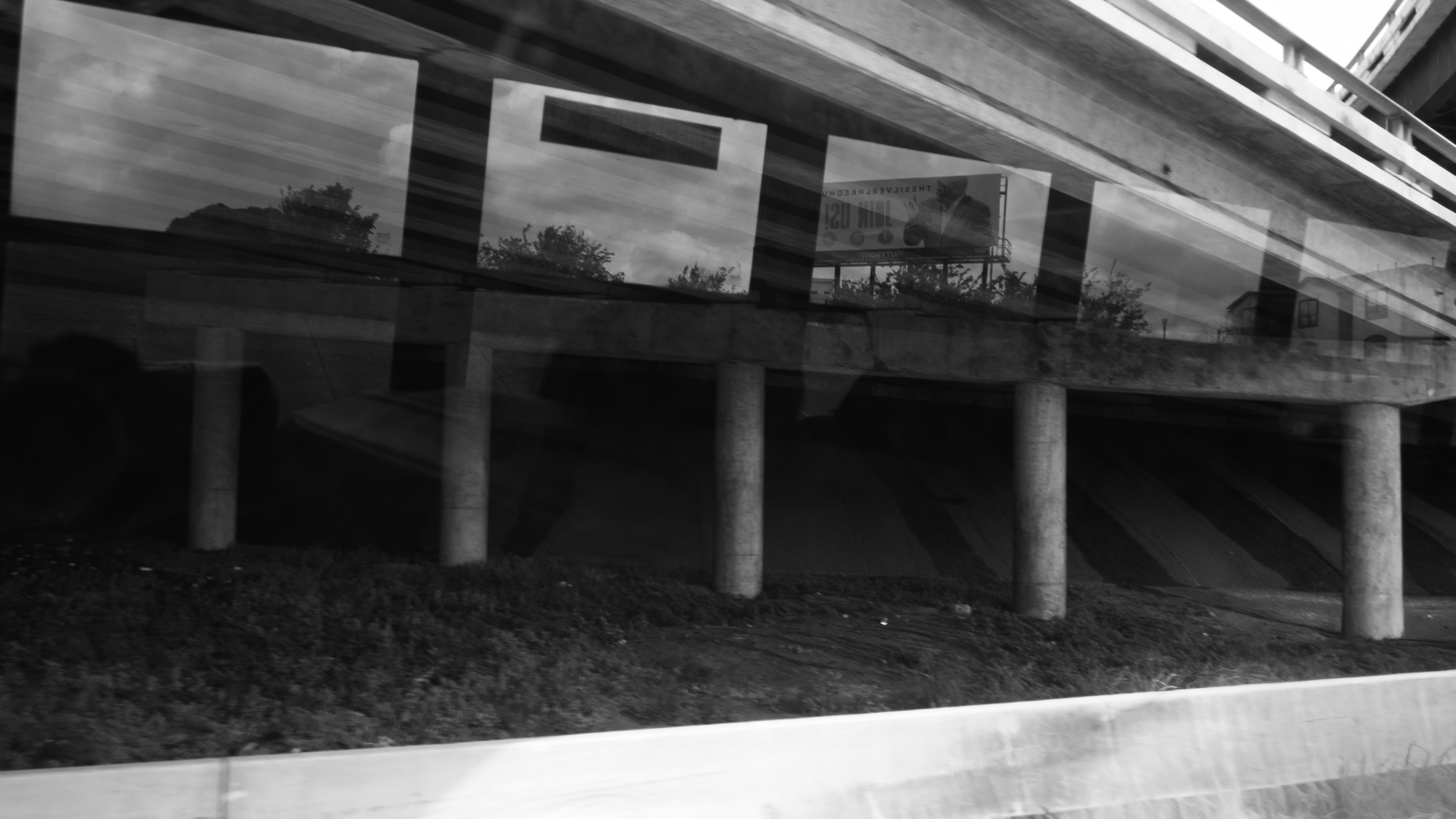 Highway overpass with window reflection