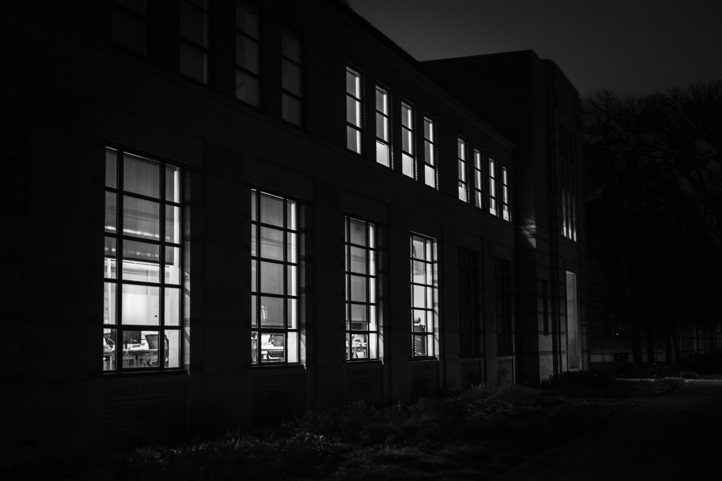 Shadow play across arched brick facade